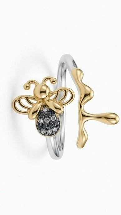 A bold 18K gold-plated ring featuring a hexagonal bolt head design filled with brilliant pavé crystals on a white background.