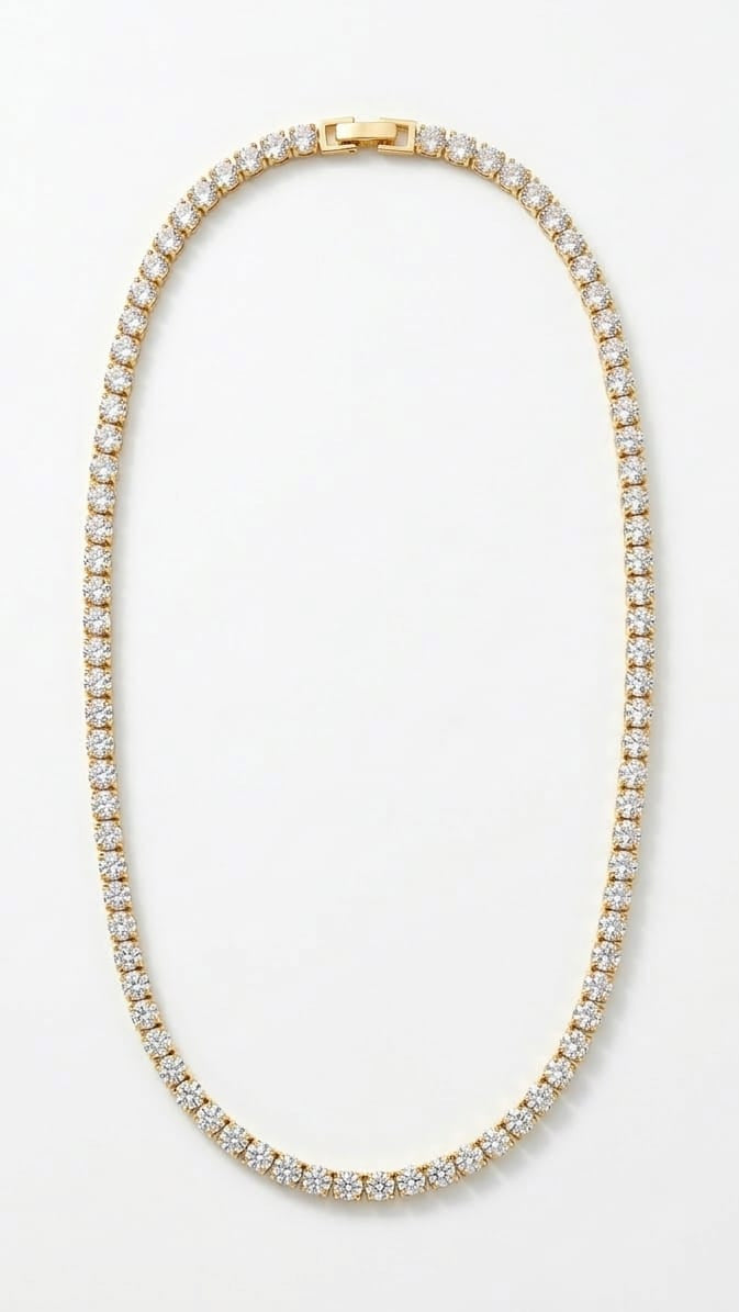 A classic tennis necklace featuring a continuous row of brilliant round-cut crystals in a high-polish gold setting.
