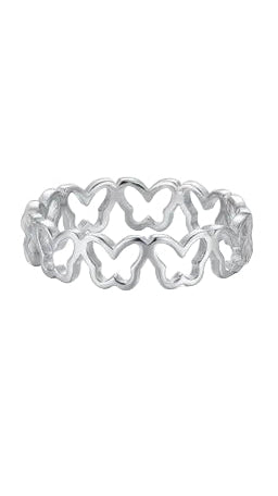 A dainty silver-toned stackable ring featuring an open-work butterfly filigree design on a woman's hand against a white background.