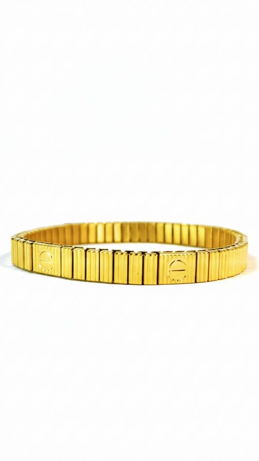 A flexible 18K gold-plated stainless steel bangle featuring a ribbed fluted texture and polished screw motifs on a white background.
