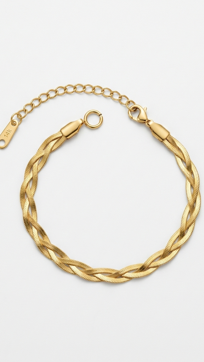 A polished 18K gold-plated braided herringbone bracelet featuring an adjustable lobster clasp and 14K hallmark tag on a white background.