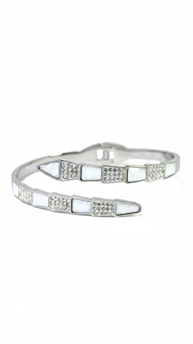 A silver-toned bypass serpent bangle featuring alternating sections of crystals and white mother-of-pearl insets on a white background.