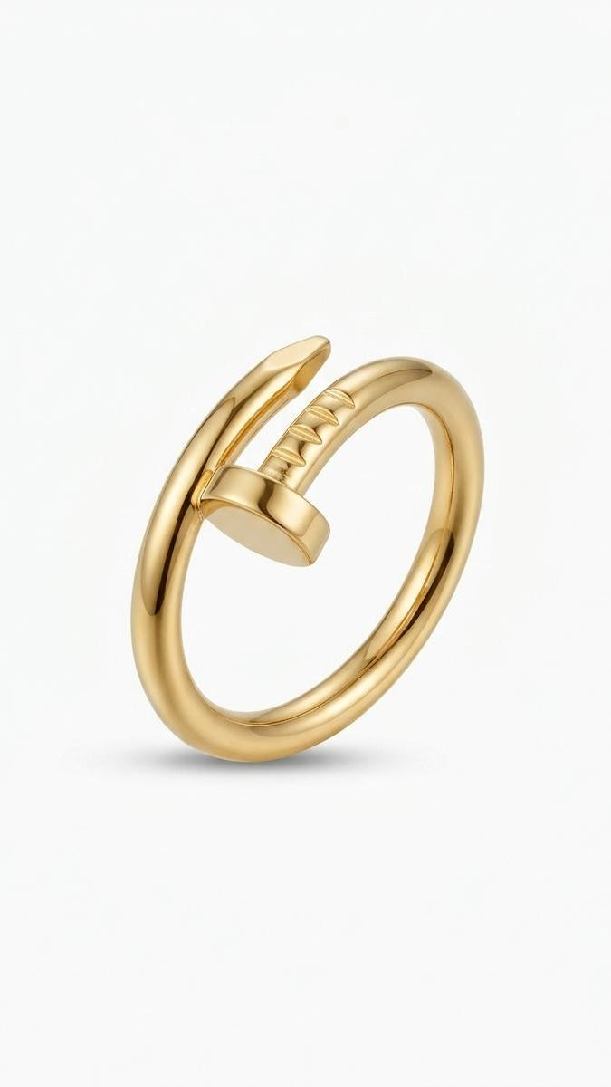 A wrap-around 18K gold-plated safety pin ring with a crystal-encrusted pavé head on a white background.