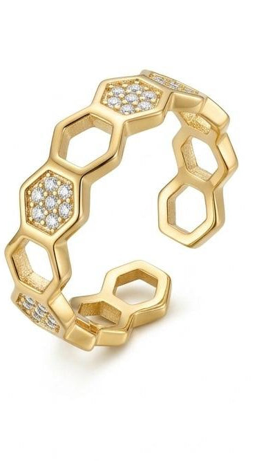 An adjustable 18K gold-plated honeycomb ring featuring a repeating hexagon pattern with alternating pavé crystal accents.