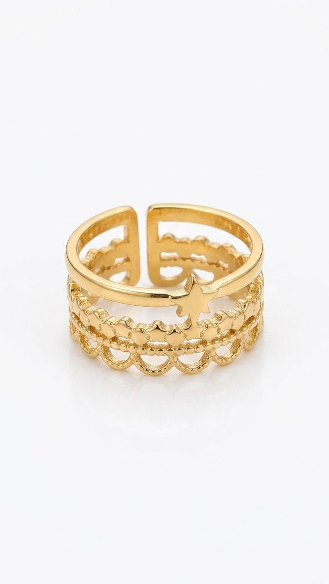 An adjustable 18K gold-plated stainless steel ring featuring three layered bands with scalloped filigree and a small central star on a white background.