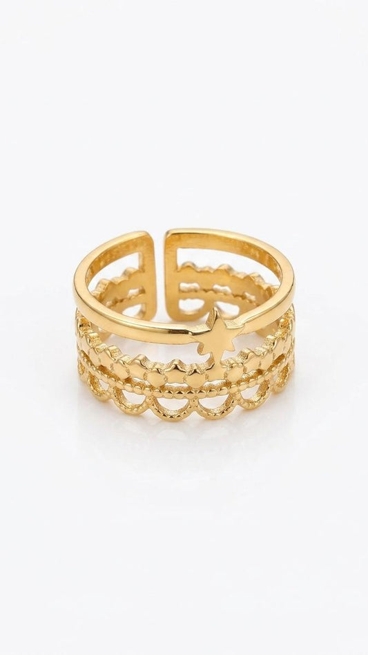 An adjustable 18K gold-plated stainless steel ring featuring three layered bands with scalloped filigree and a small central star on a white background.