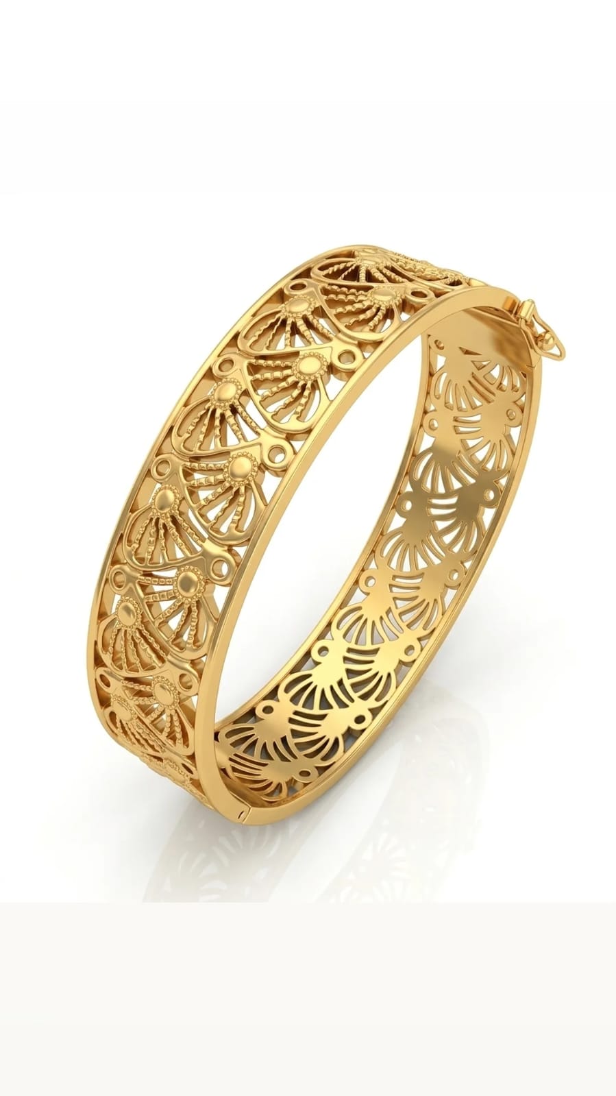Gold bracelet with intricate filigree design on a white background