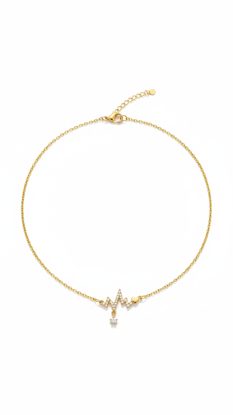 Gold necklace with a heart-shaped pendant on a white background