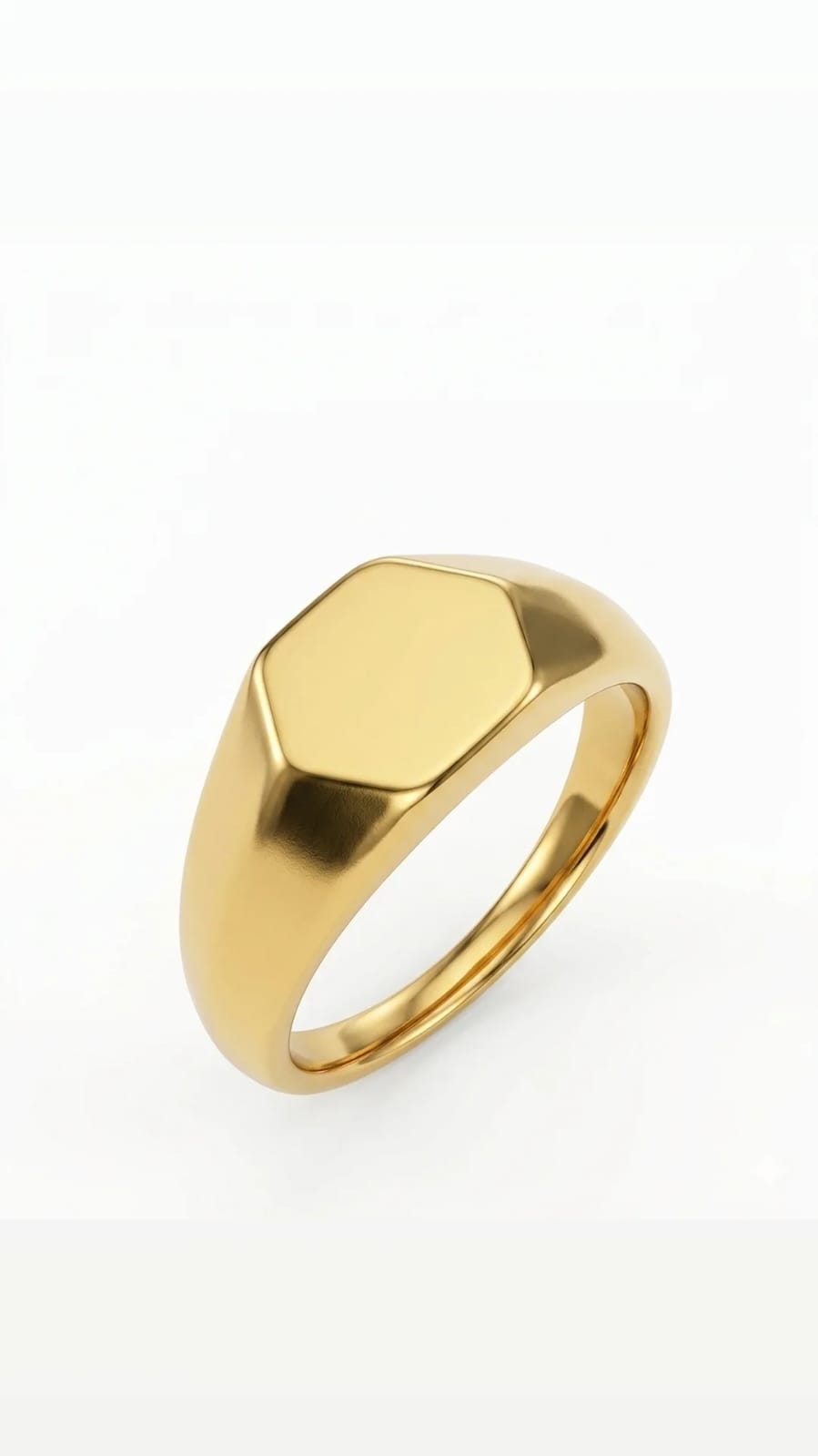 Gold ring with a geometric design on a white background