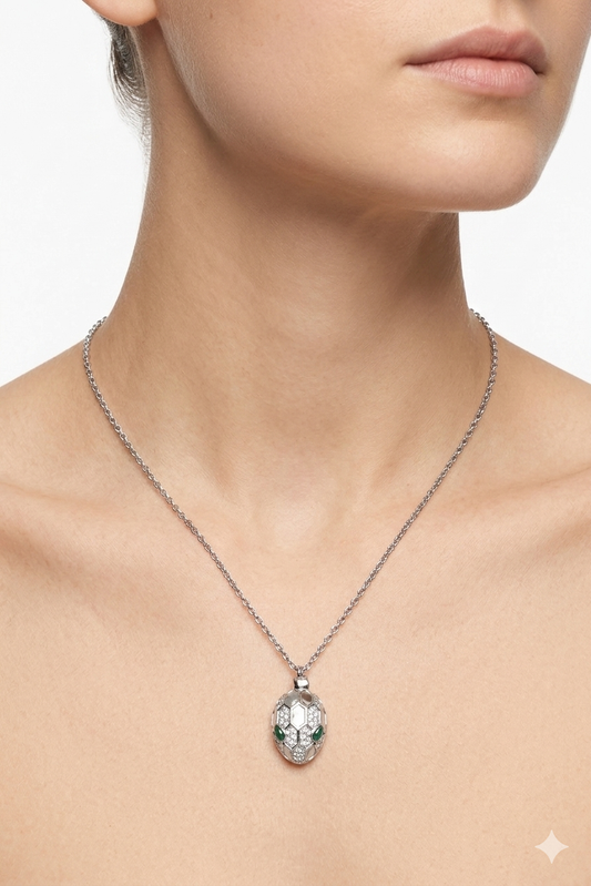 Serpent Gaze Medallion Necklace – Silver Pavé Snake Head with Emerald Accents