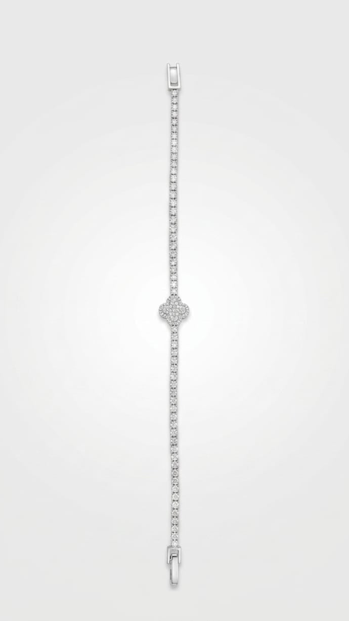 Overhead view of the Prestige full pavé tennis bracelet showing the secure clasp and clover detail.