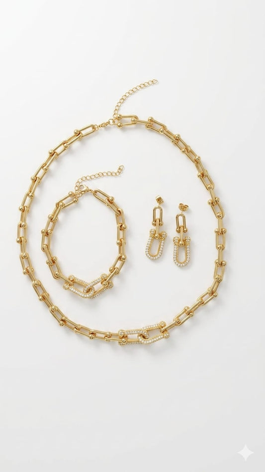Presteige Accessories complete gold U-link and pavé crystal jewelry set on plain white background.
