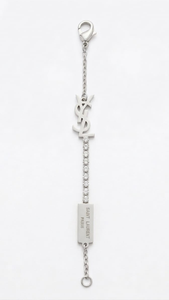 Prestige Accessories silver monogram bracelet with crystals and logo plaque on a white background.